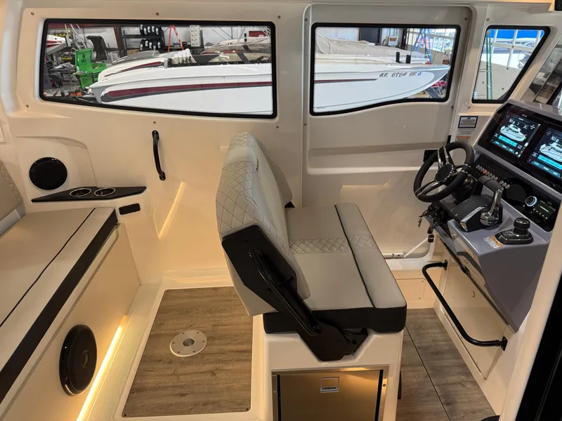Slide: The Image of Interior of 2025 Navan C30 boat with modern helm and seating. - 35