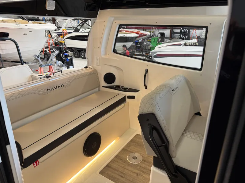 Slide: The Image of Interior of 2025 Navan C30 boat with modern seating and window view. - 36