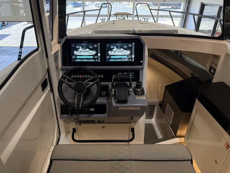 Slide: The Image of Interior cockpit of 2025 Navan C30 boat with dual navigation screens and modern controls. - 37