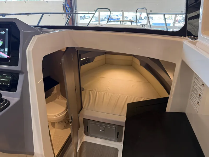 Slide: The Image of Interior cabin of 2025 Navan C30 boat, featuring a cozy sleeping area and compact bathroom. - 40