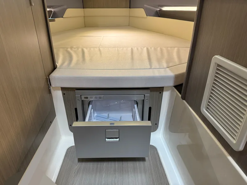 Slide: The Image of Interior of 2025 Navan C30 with a compact drawer under a bed. - 44