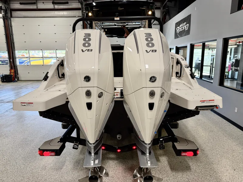 Slide: The Image of Twin 300 V8 engines on a 2025 Navan C30 boat in a showroom. - 5