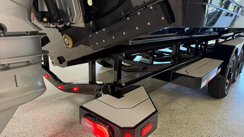 Slide: The Image of Rear view of 2025 Navan C30 boat trailer with red lights and sturdy frame. - 8