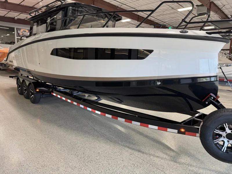 Slide: The Image of 2025 Navan C30 boat on trailer in indoor showroom. - 9