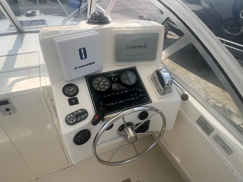 Slide: The Image of 2003 Albemarle 268 Express Fisherman helm with Garmin and Furuno navigation systems. - 16