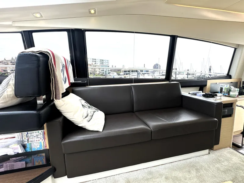 Slide: The Image of Luxurious interior of a 2017 Prestige 500 S yacht with leather sofa and large windows. - 18