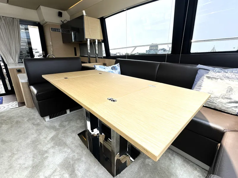 Slide: The Image of Luxurious interior of 2017 Prestige 500 S yacht with modern dining area and leather seating. - 19