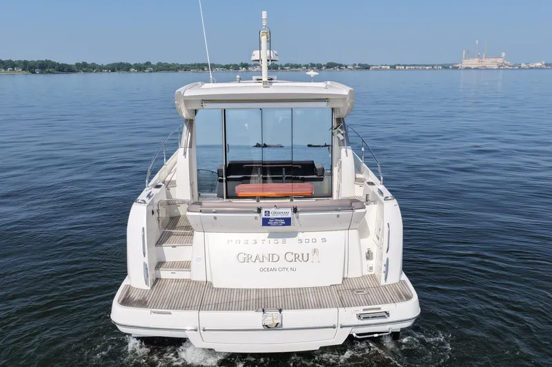Slide: The Image of Prestige 500S yacht cruising on calm waters, rear view, 2017 model. - 10