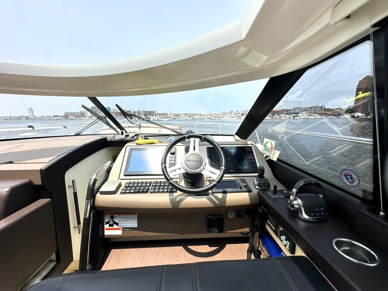 Slide: The Image of Cockpit of 2017 Prestige 500 S yacht with modern navigation equipment and steering wheel. - 23