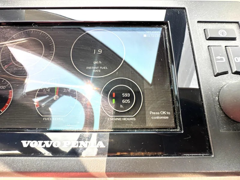 Slide: The Image of Dashboard of a 2017 Prestige 500 S showing engine hours and fuel rate. - 26
