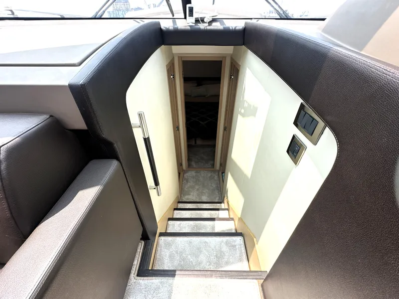 Slide: The Image of Staircase leading to cabin interior of 2017 Prestige 500 S yacht. - 28