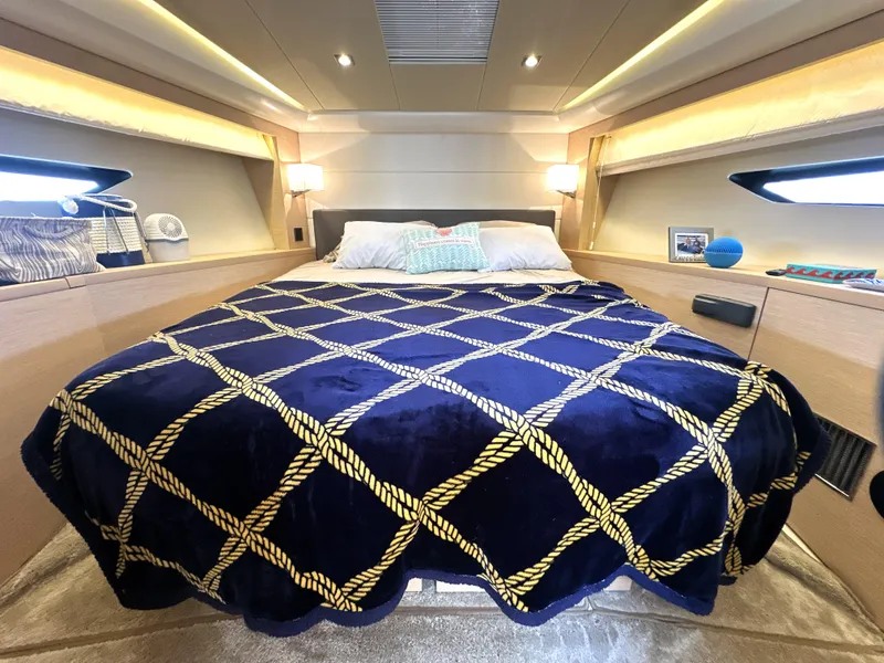 Slide: The Image of Luxurious bedroom interior of 2017 Prestige 500 S yacht with elegant bedding and ambient lighting. - 3