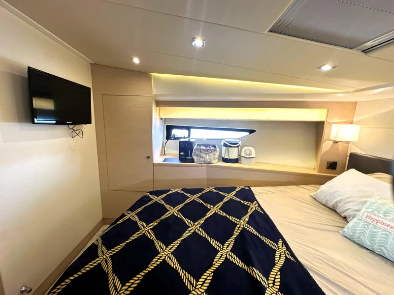Slide: The Image of Luxurious cabin interior of 2017 Prestige 500 S yacht with modern decor and cozy bedding. - 30