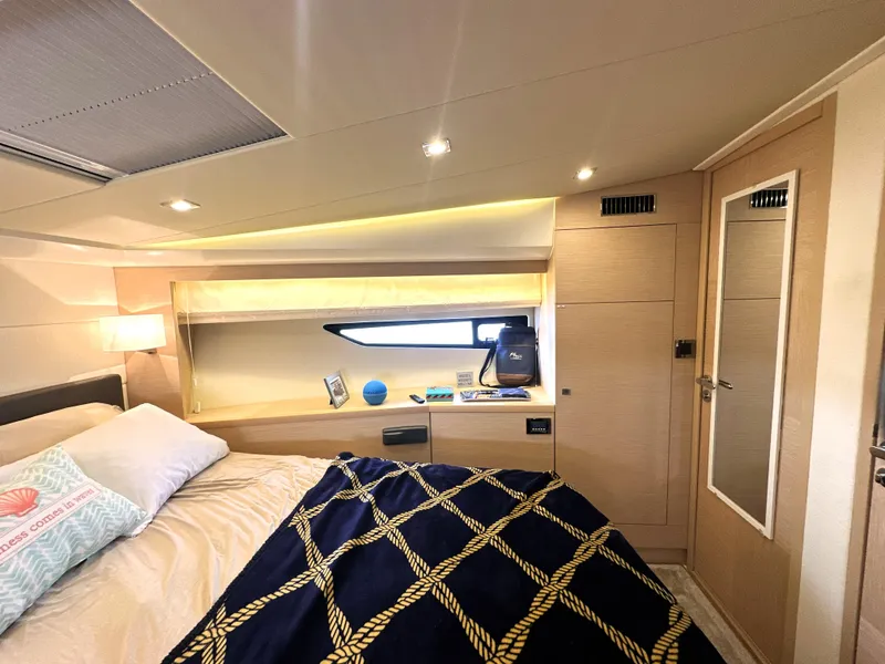 Slide: The Image of Luxurious cabin interior of 2017 Prestige 500 S yacht with modern decor and cozy bedding. - 31