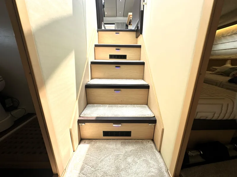 Slide: The Image of Staircase inside 2017 Prestige 500 S yacht, featuring carpeted steps and modern design. - 35