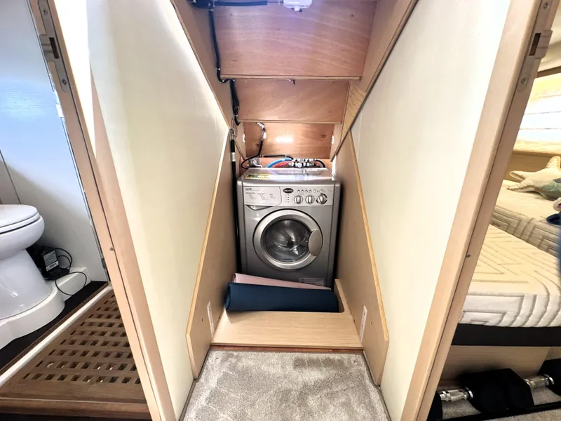 Slide: The Image of Laundry area with washing machine in 2017 Prestige 500 S yacht interior. - 36