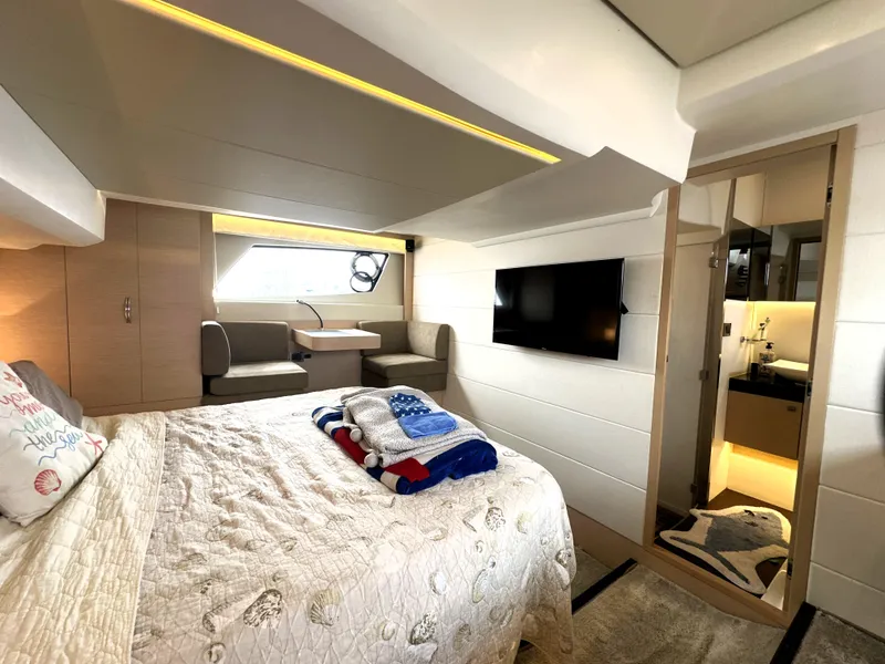 Slide: The Image of Luxurious interior of a 2017 Prestige 500 S yacht with cozy bedroom and modern amenities. - 38