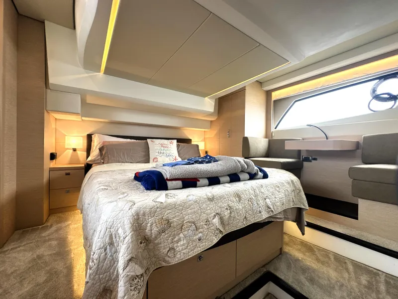 Slide: The Image of Luxurious bedroom interior of 2017 Prestige 500 S yacht with modern design and cozy bedding. - 39