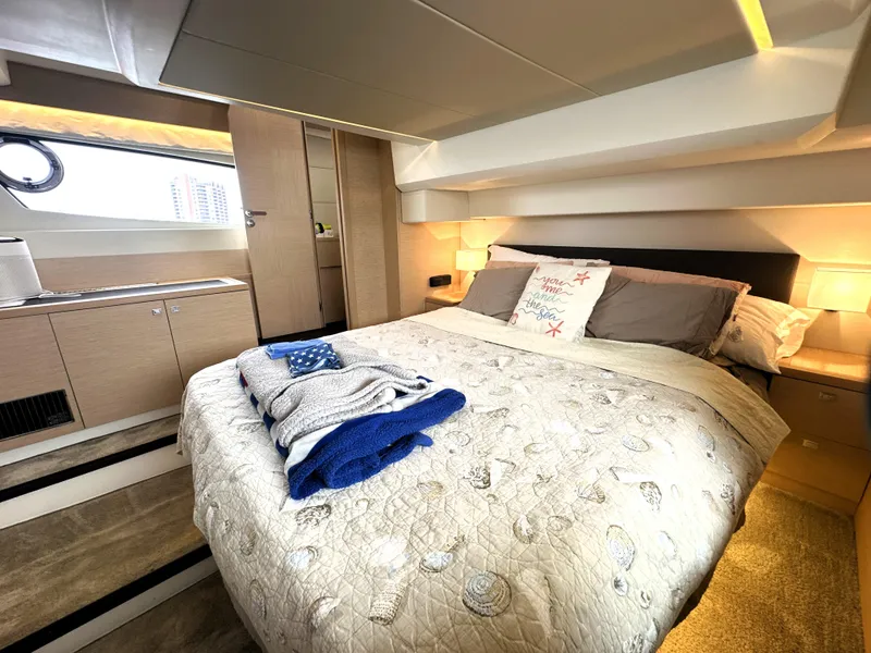 Slide: The Image of Luxurious bedroom interior of 2017 Prestige 500 S yacht with cozy bedding and modern design. - 40