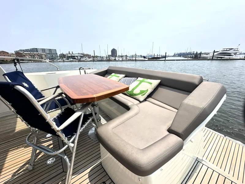 Slide: The Image of Luxury seating area on 2017 Prestige 500 S yacht with marina view. - 5