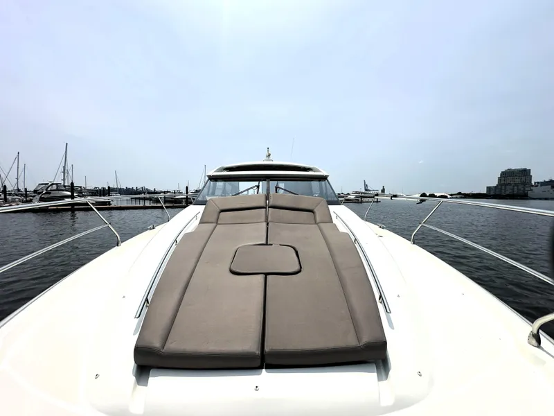 Slide: The Image of 2017 Prestige 500 S yacht with sunbed, docked in a marina. - 9