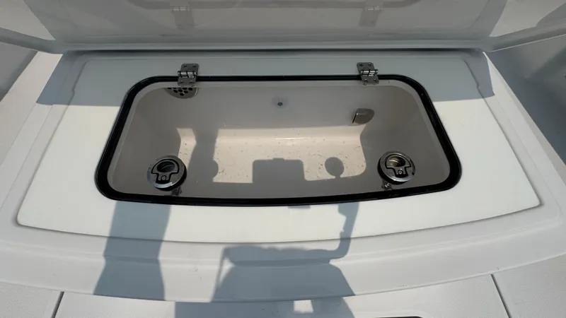Slide: The Image of Open storage compartment on a 2026 Jupiter 32 boat. - 12