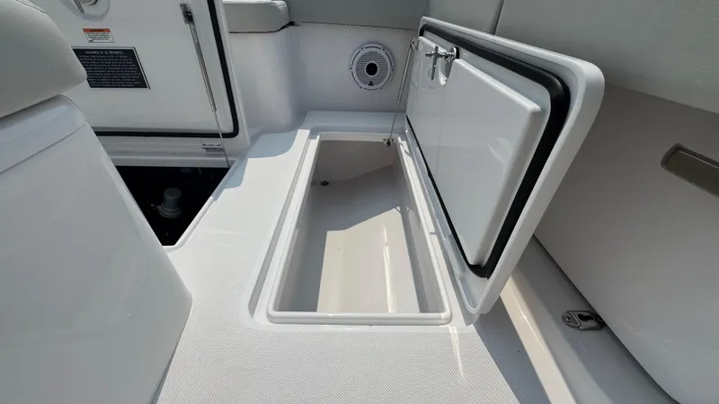 Slide: The Image of Open storage compartment on a 2026 Jupiter 32 boat deck. - 17