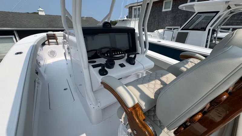 Slide: The Image of 2026 Jupiter 32 boat cockpit with modern controls and comfortable seating. - 22