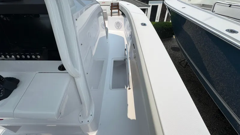 Slide: The Image of 2026 Jupiter 32 boat deck with seating and control panel, showcasing sleek design and functionality. - 29