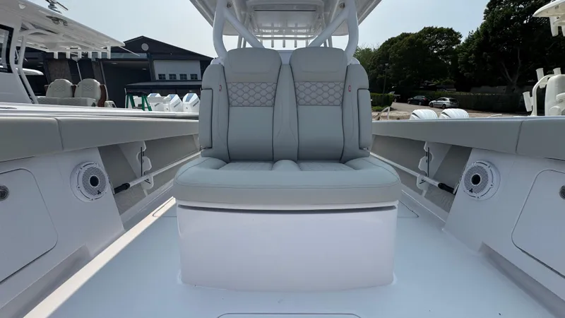 Slide: The Image of 2026 Jupiter 32 boat interior with cushioned seating and modern design. - 31