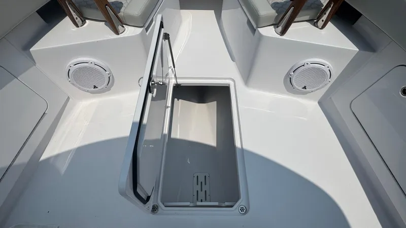 Slide: The Image of Open storage compartment on a 2026 Jupiter 32 boat deck. - 35