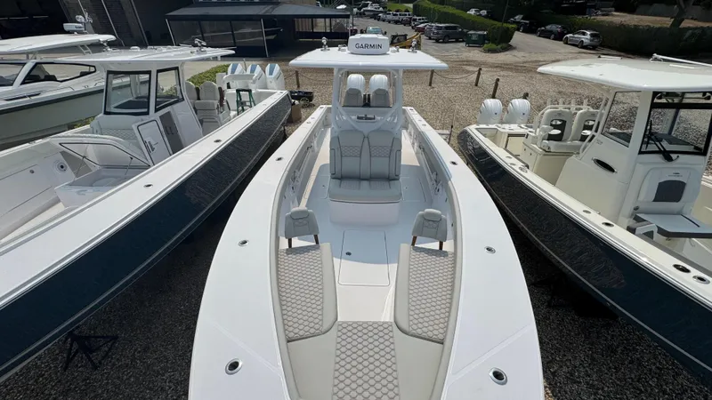 Slide: The Image of 2026 Jupiter 32 boat with sleek design, docked among other vessels. - 39