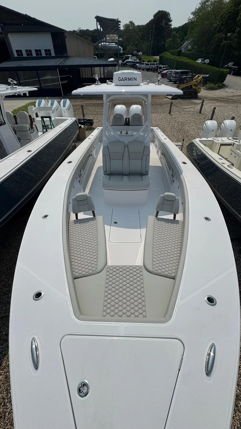 Slide: The Image of 2026 Jupiter 32 boat with sleek design, spacious deck, and modern seating. - 40
