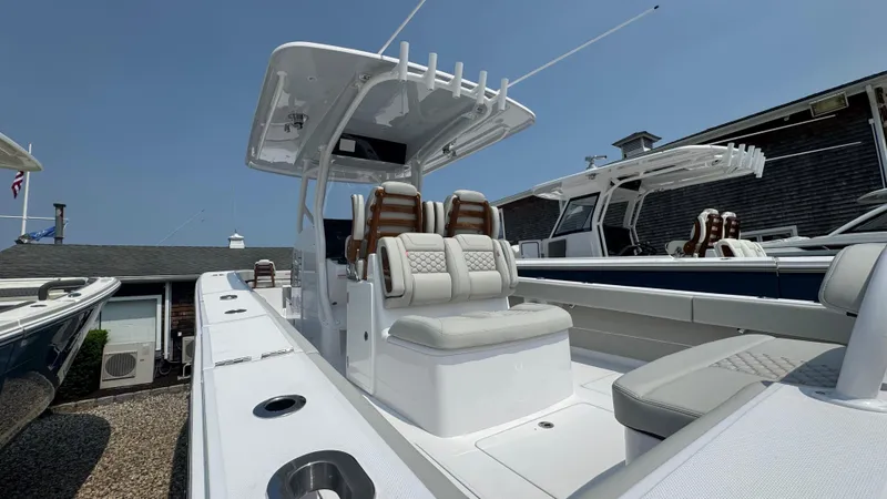 Slide: The Image of 2026 Jupiter 32 boat with sleek design and comfortable seating. - 5