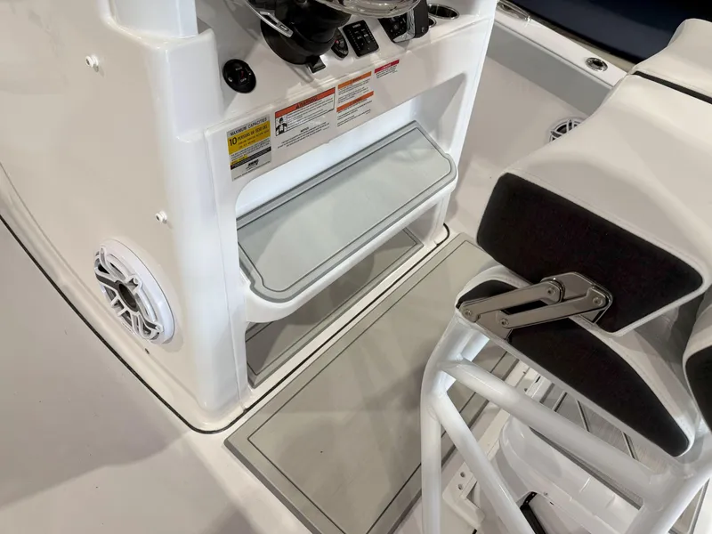 Slide: The Image of 2026 Blackfin 242HB boat interior with seating and storage compartments. - 24