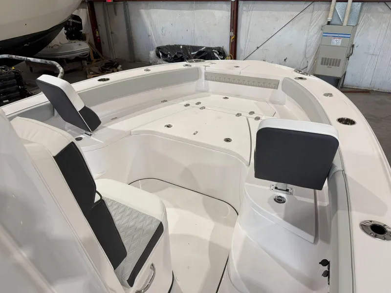 Slide: The Image of 2026 Blackfin 242HB boat interior with white seating and black accents. - 27
