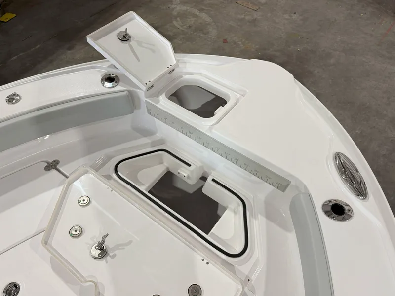 Slide: The Image of 2026 Blackfin 242HB boat deck with storage compartments and cup holders. - 29