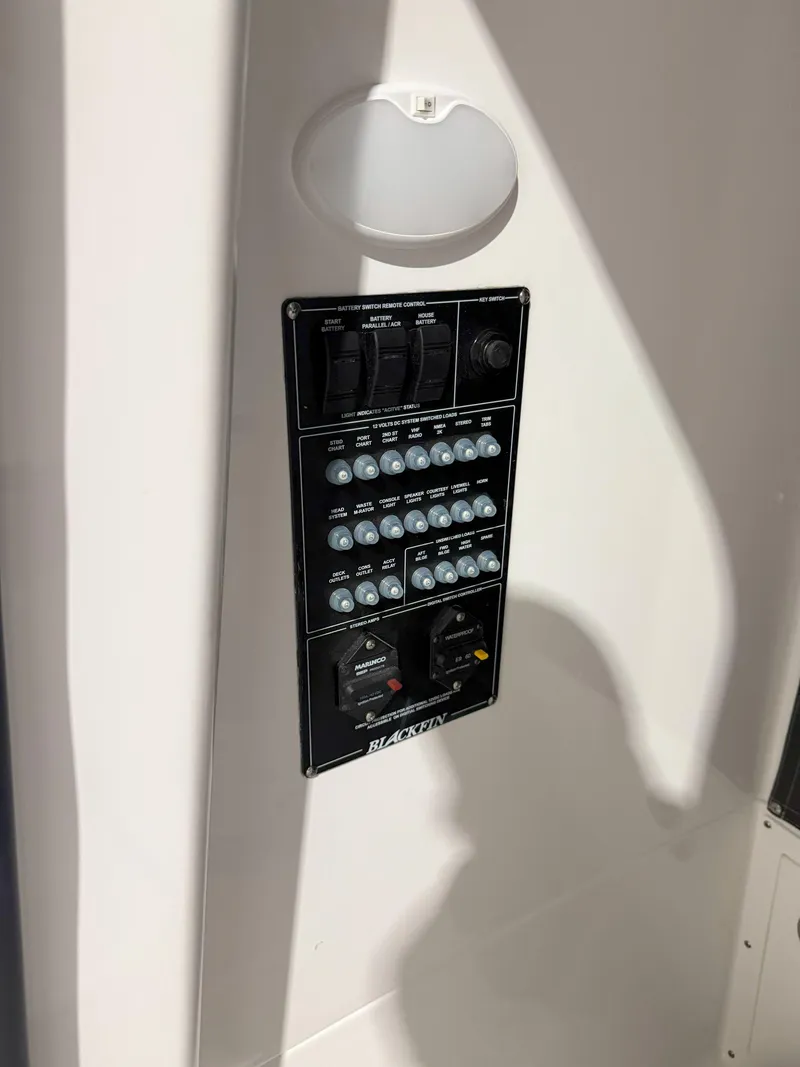 Slide: The Image of 2026 Blackfin 242HB control panel with switches and circuit breakers. - 31