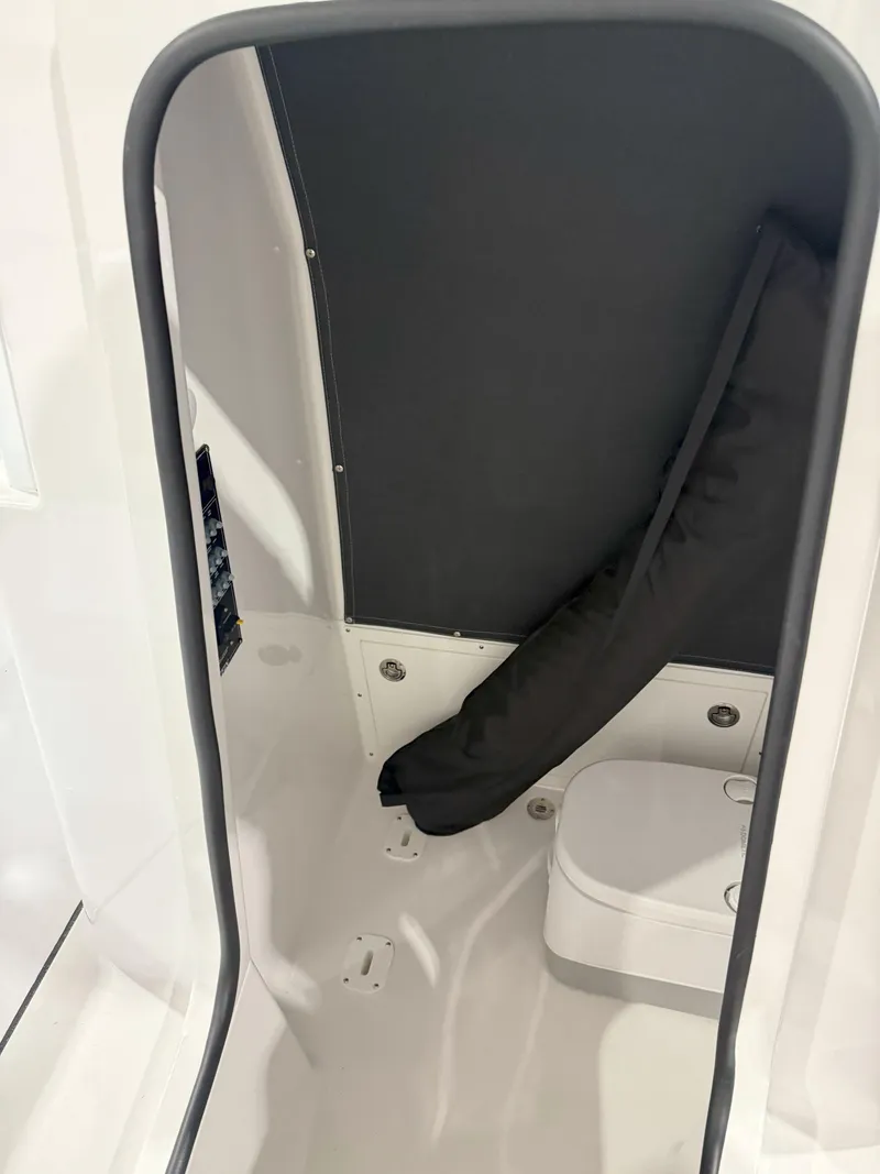 Slide: The Image of Interior of 2026 Blackfin 242HB boat, featuring compact cabin space. - 33