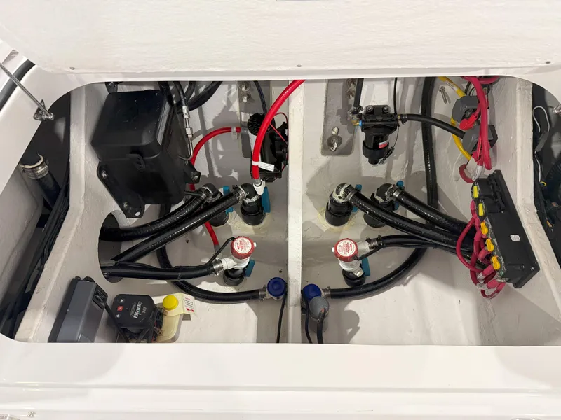 Slide: The Image of Engine compartment of a 2026 Blackfin 242HB boat, showcasing wiring and components. - 35