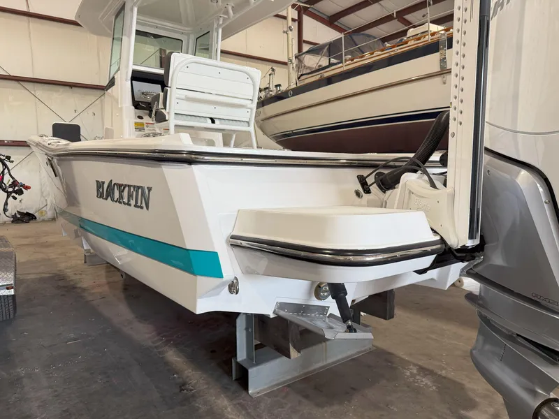 Slide: The Image of 2026 Blackfin 242HB boat in a storage facility, showcasing sleek design and modern features. - 7