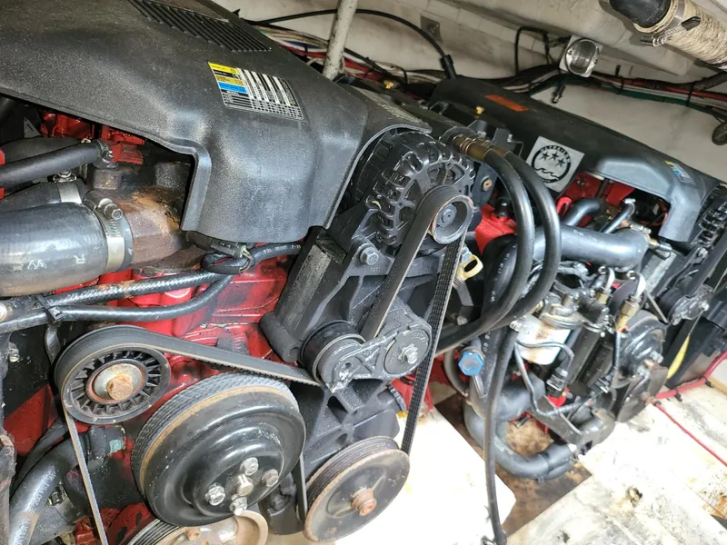 Slide: The Image of Engine compartment of a 2004 Cruisers 280CXi boat, showcasing mechanical components. - 16