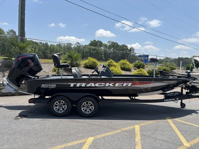 Slide: The Image of 2025 Tracker SAVAGE™ 215 boat on trailer, parked outdoors under clear sky. - 10