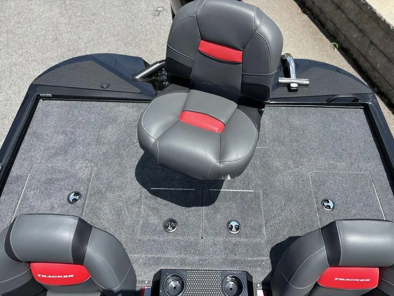 Slide: The Image of 2025 Tracker SAVAGE™ 215 boat interior with gray and red seating. - 12