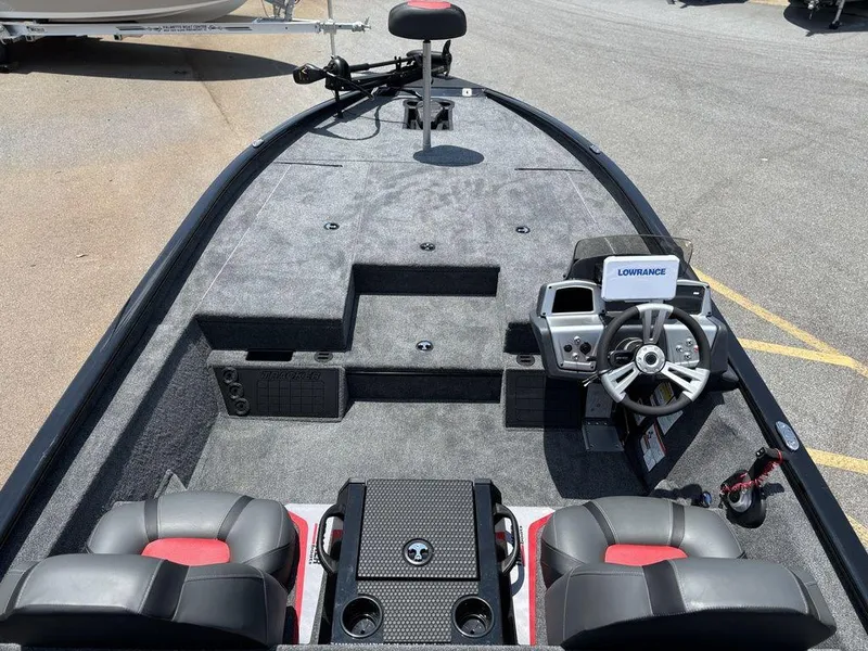 Slide: The Image of 2025 Tracker SAVAGE™ 215 boat interior with steering console and seating. - 16