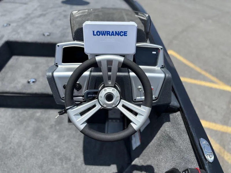 Slide: The Image of Steering wheel of 2025 Tracker SAVAGE™ 215 boat with Lowrance display. - 6