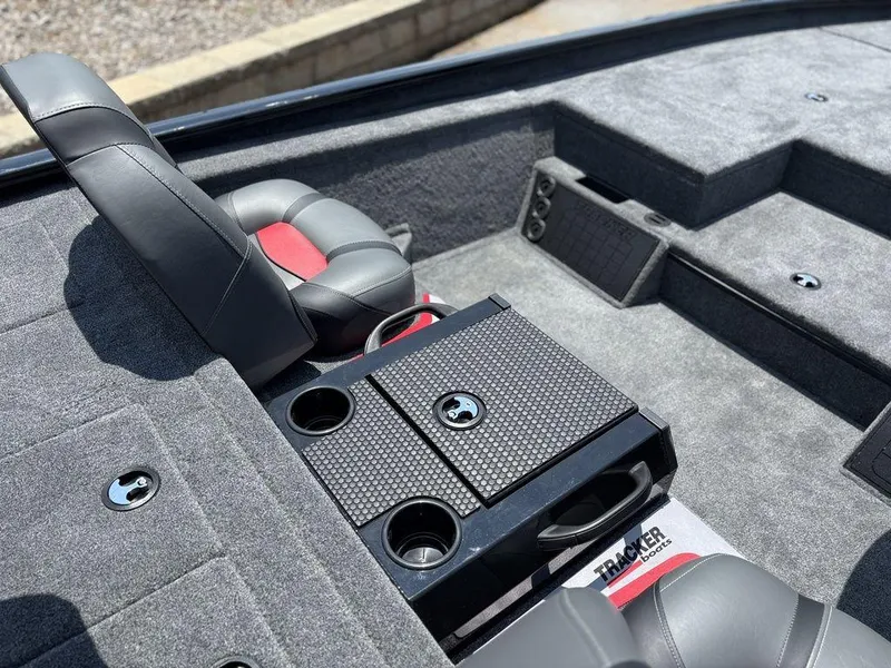 Slide: The Image of 2025 Tracker SAVAGE™ 215 boat interior with seating and storage compartments. - 8