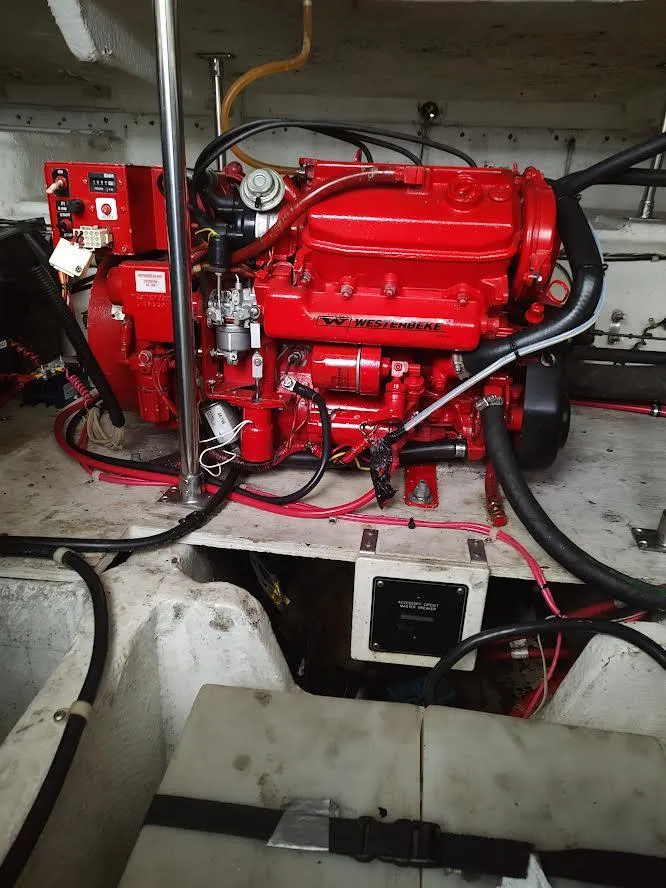 Slide: The Image of Engine compartment of a 1998 Maxum 4100 Sun Bridge SCR with a red engine. - 26