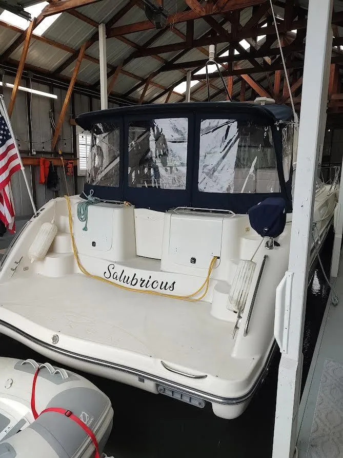 Slide: The Image of 1998 Maxum 4100 Sun Bridge SCR yacht docked in a covered marina. - 5