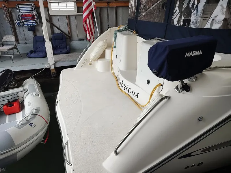 Slide: The Image of 1998 Maxum 4100 Sun Bridge SCR docked with inflatable boat nearby. - 6